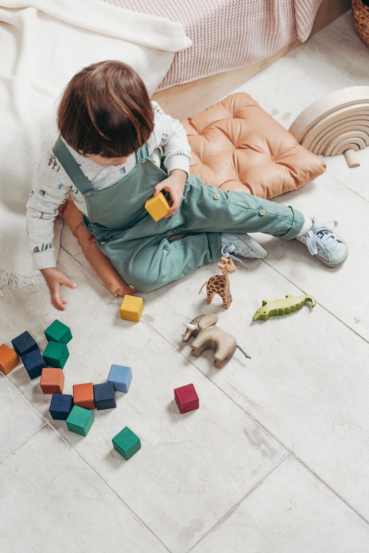 toddler playing with toys.